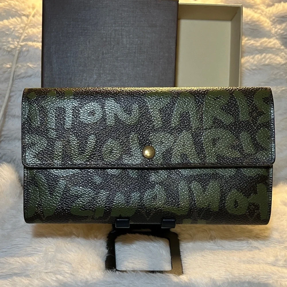 338. Louis Vuitton Limited Edition Monogram Graffiti Sarah Wallet,